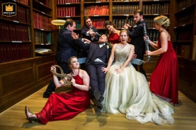 At the Carnegie Institution for Science, the creatively lit indoor bridal party recreates a playful childhood game during their group portrait session.